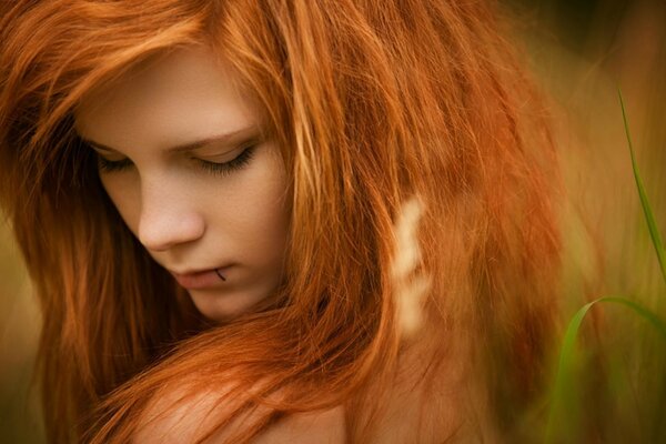 Girl with red hair macro photo