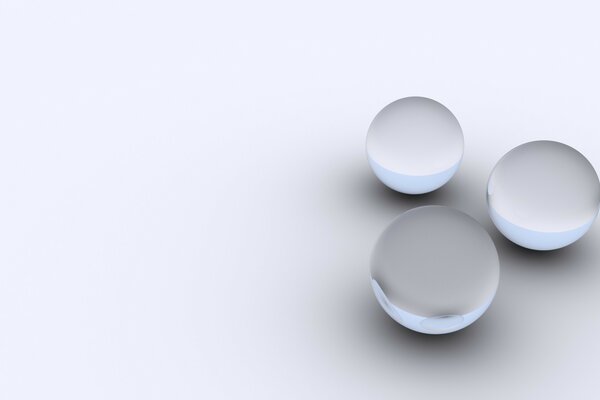 Three gray balls on a light background