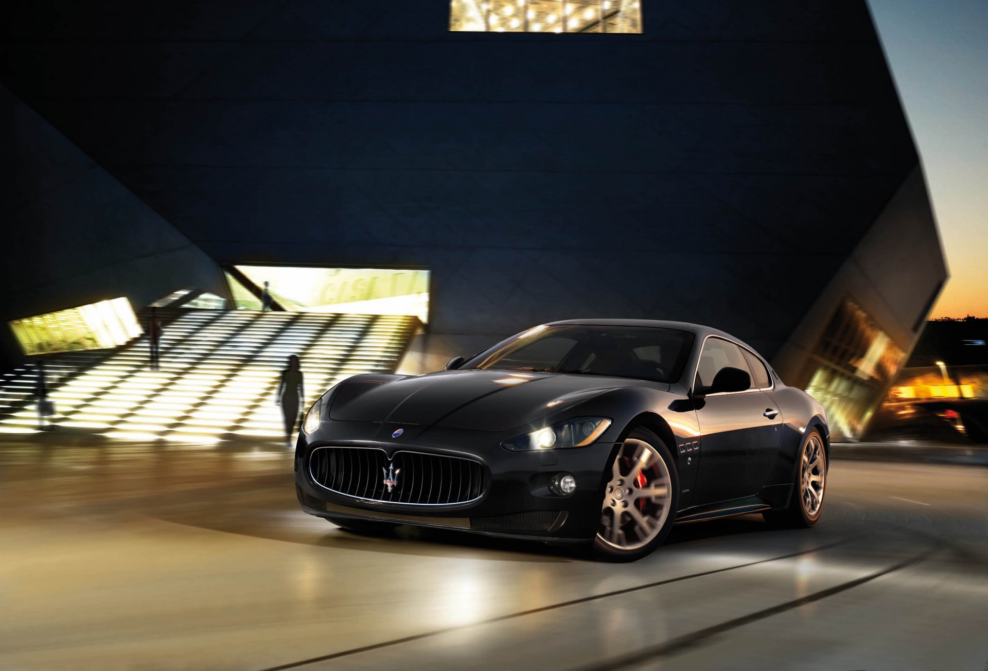 maserati granturismo black night light blur building