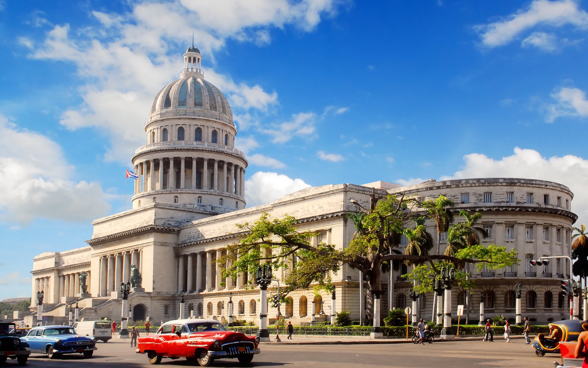 the city architecture cuba havana auto road center the dome building home pedestrians the sky clouds tower tree people avenue day sunny machine