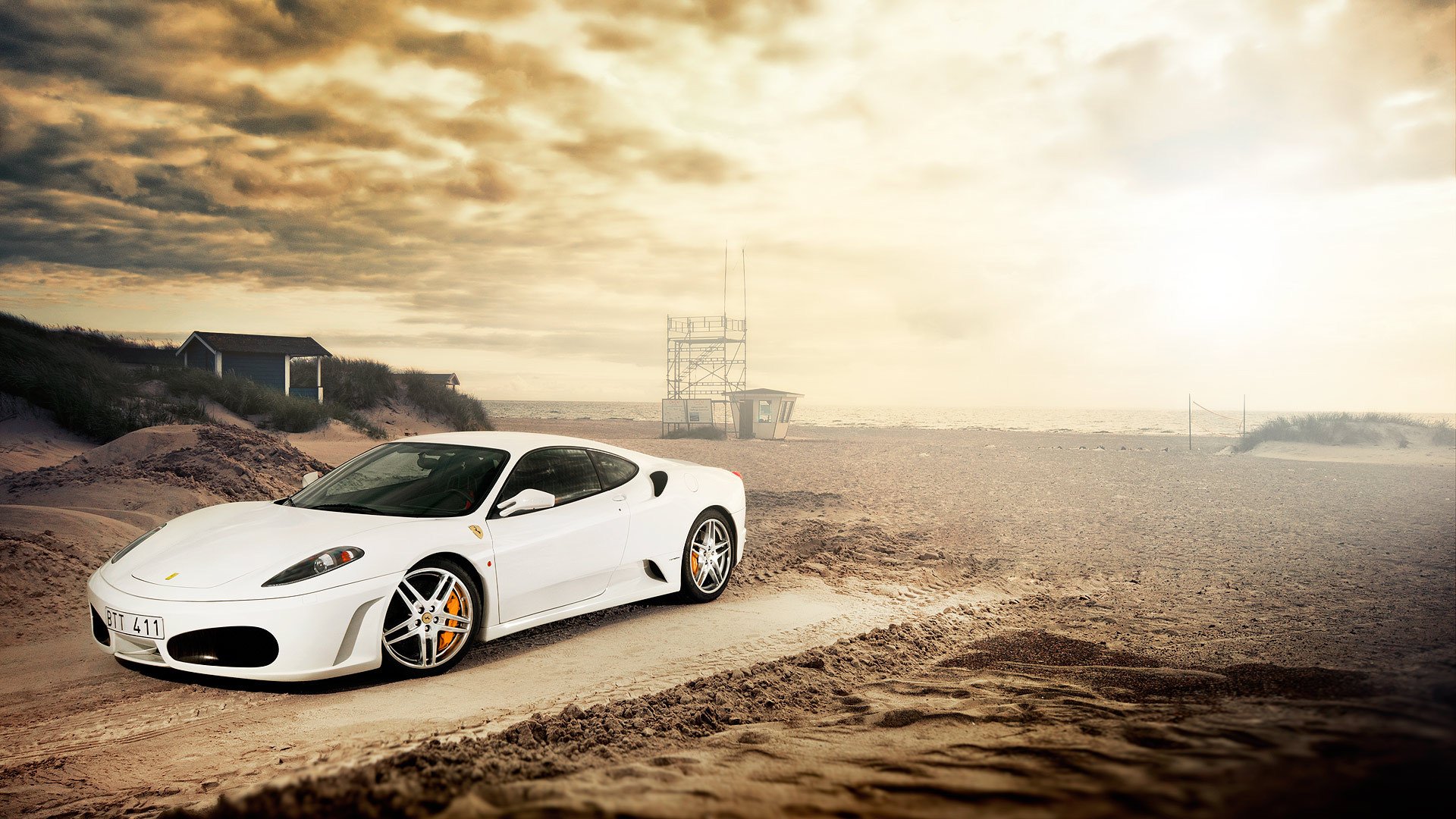 ferrari f-430 blanc avant ferrari blanc plage sable éblouissement