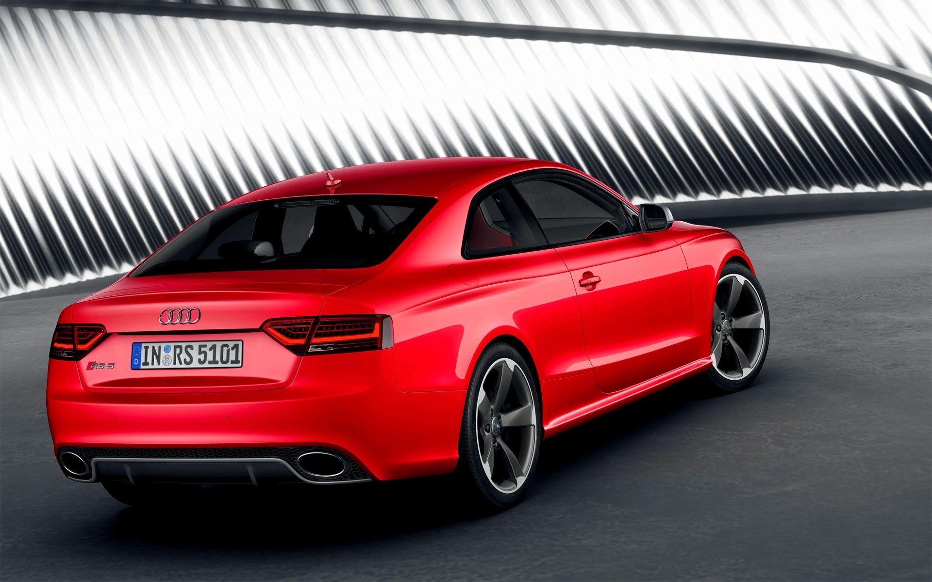 audi rs5 machine red drives coupe