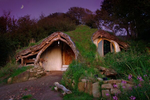 Stone house in the forest at sunset