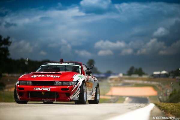 Red sports Nissan flaunts on the road