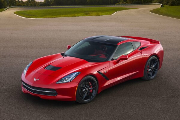 Red sports car Corvette c7 on asphalt