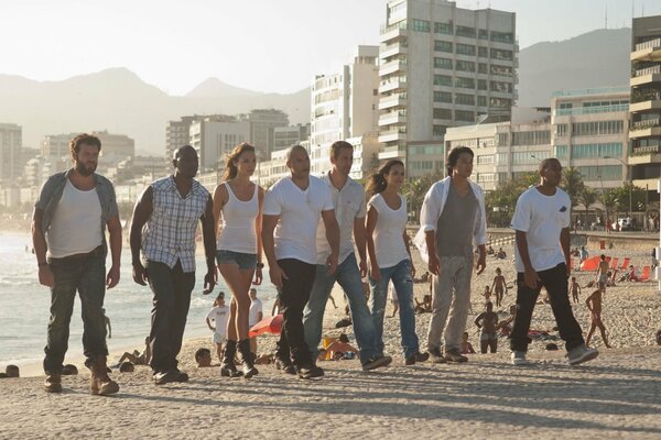 The actors of the film fast and furious 5 on the background of the sea