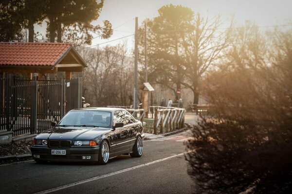 A tuned boomer is standing on the road