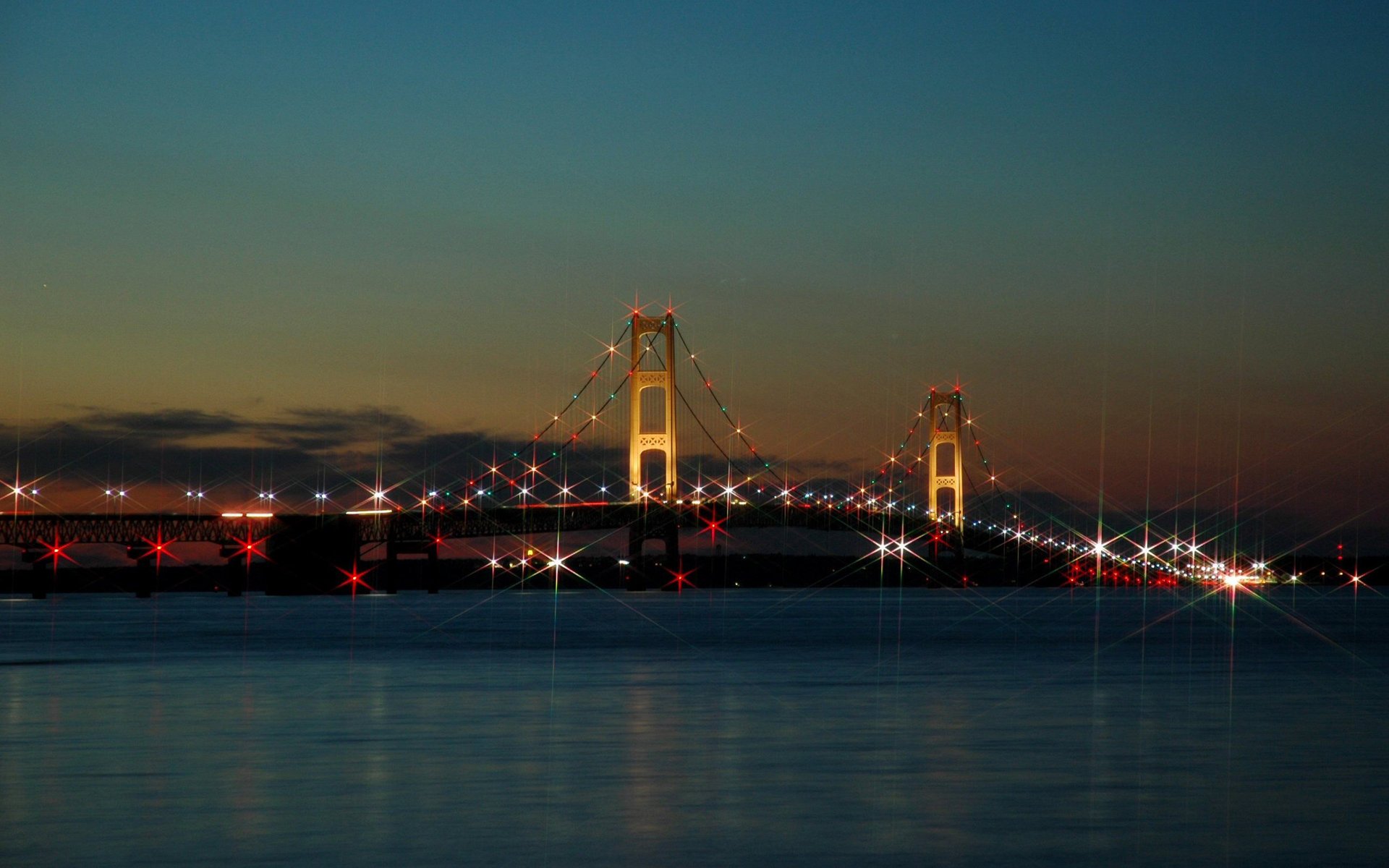 puente ciudad luces cielo puesta de sol