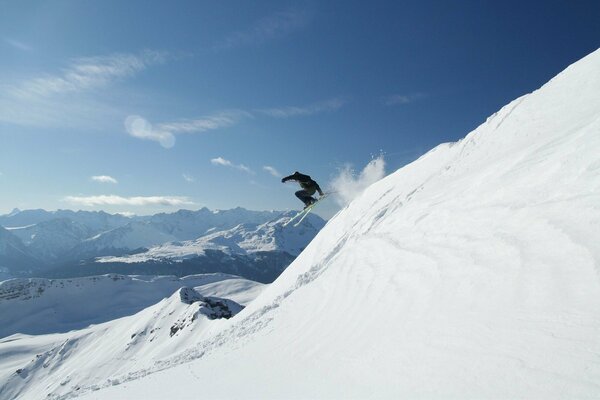 Steep descent from the mountain in the snow. Com