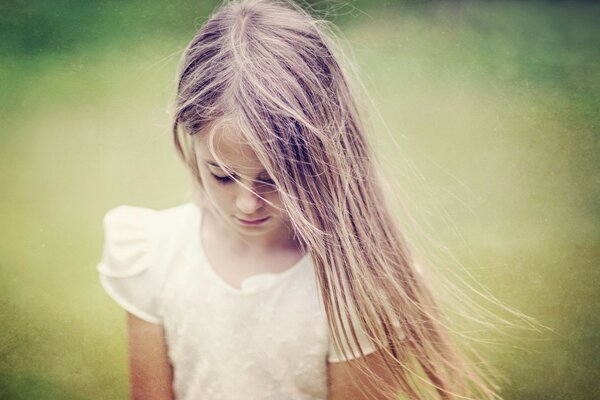 Photo shoot of a girl model in a field with a blurry background