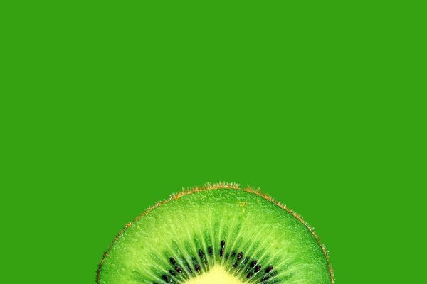 Papel pintado estético de kiwi en corte. Fruta verde