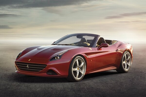 A luxury red sports car against a foggy sky. A chic red Ferrari on a gray foggy background