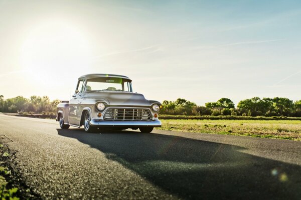Classic Chevrolet car driving on the road
