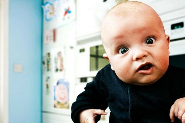 A small child with funny grimaces