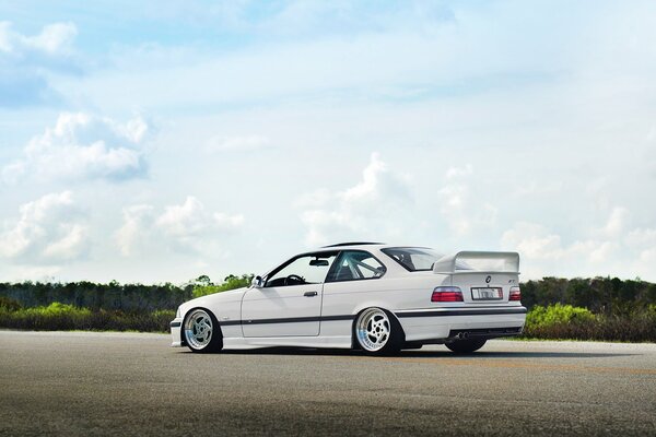 White BMV M3 on the background of a beautiful landscape