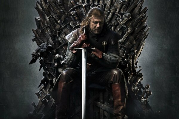 Un homme avec une épée sur le trône de la série télévisée Game of Thrones