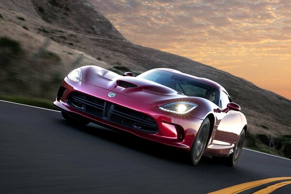 Cherry car rushes on a flat road