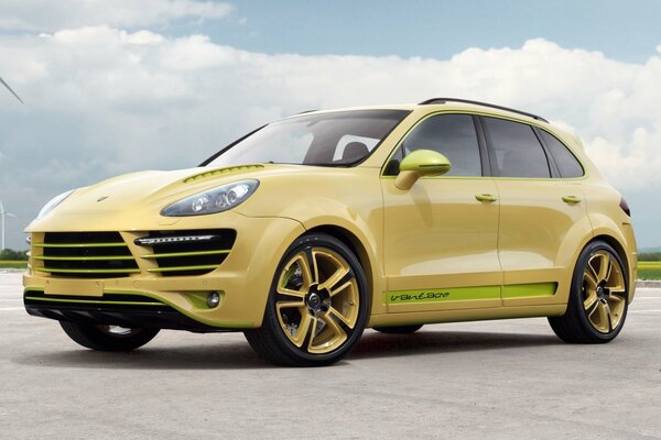 A golden Porsche on a background of windmills and clouds