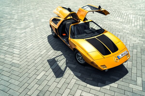 Yellow prototype c111 on paving stones