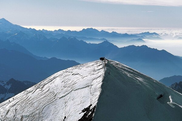 People on the mountain in the fog