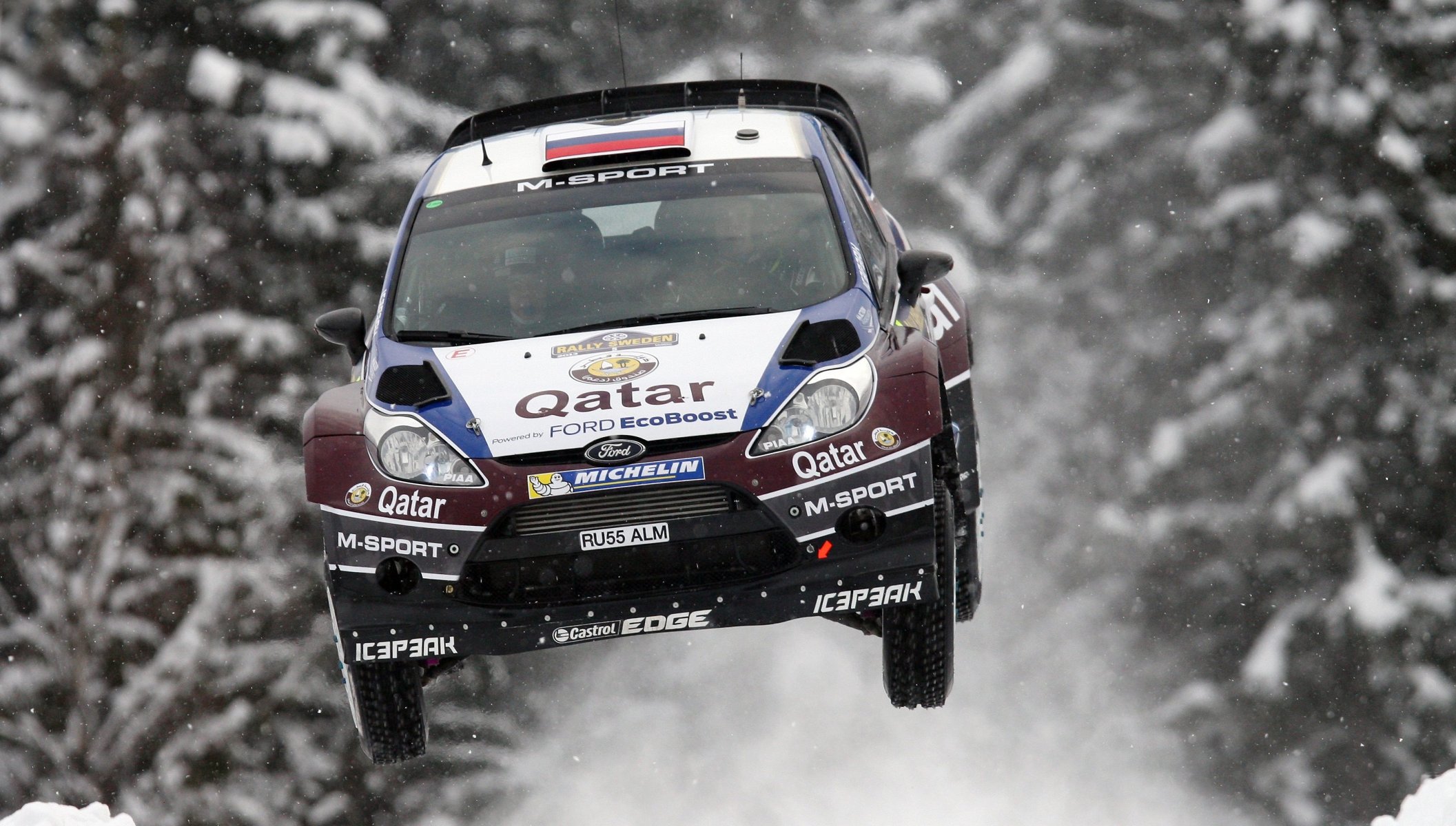 ford fiesta rally wrc evgeny novikov flight in the air winter snow forest machine competition