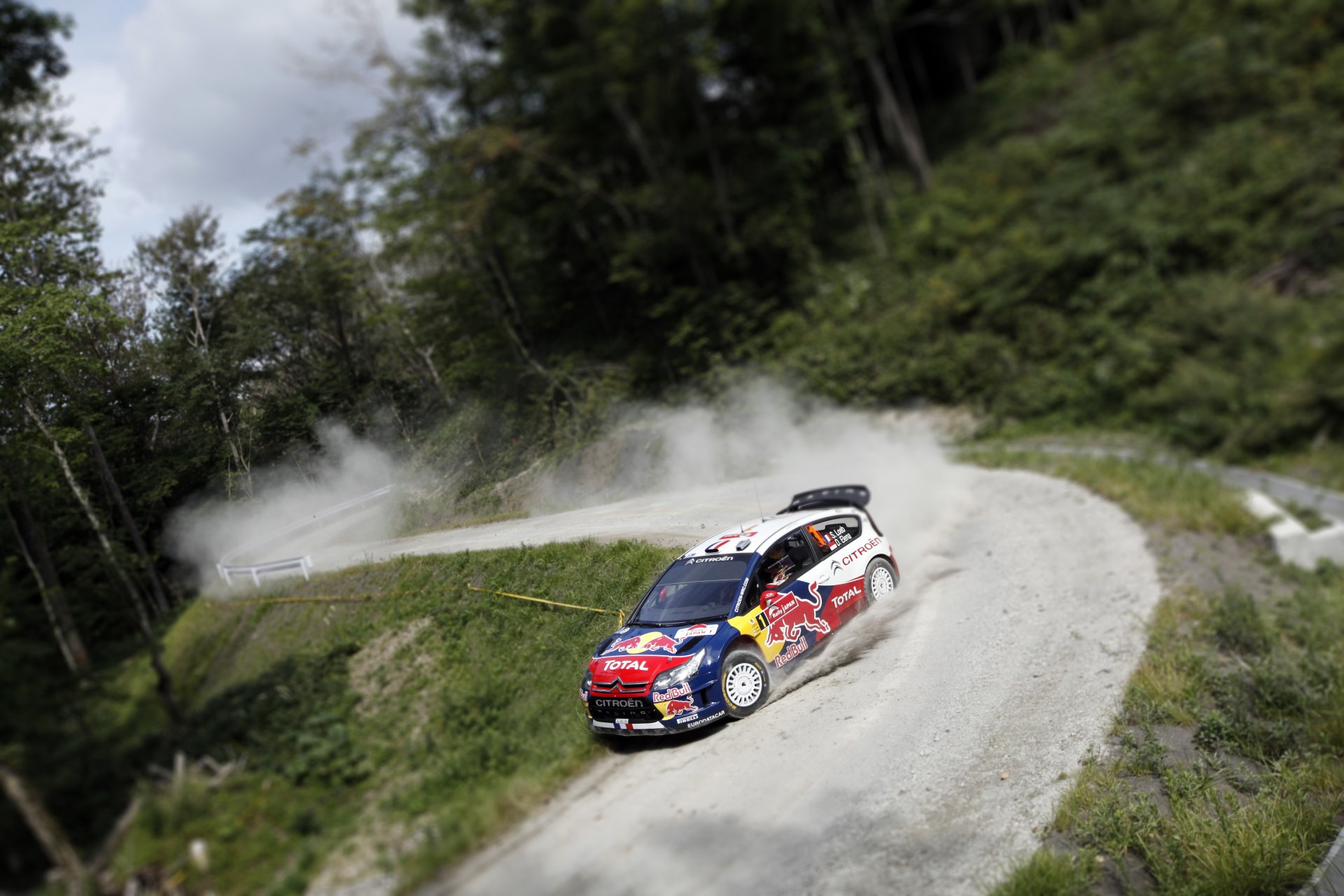 citroen c4 rally wrc tilt-shift sebastien ogier front blur forest road rotation competition