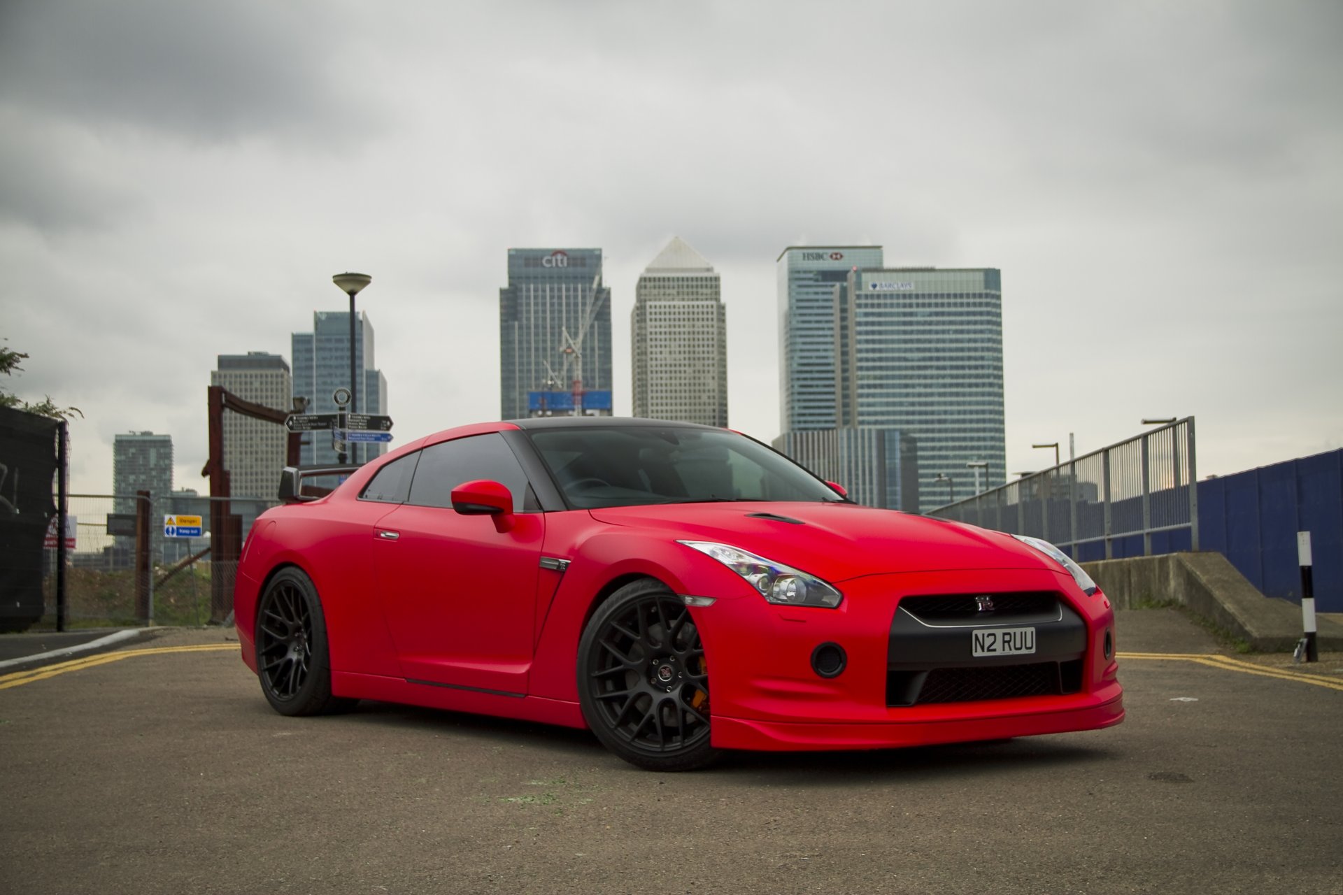 nissan gtr r35 red nissan gtr red front view buildings city sky