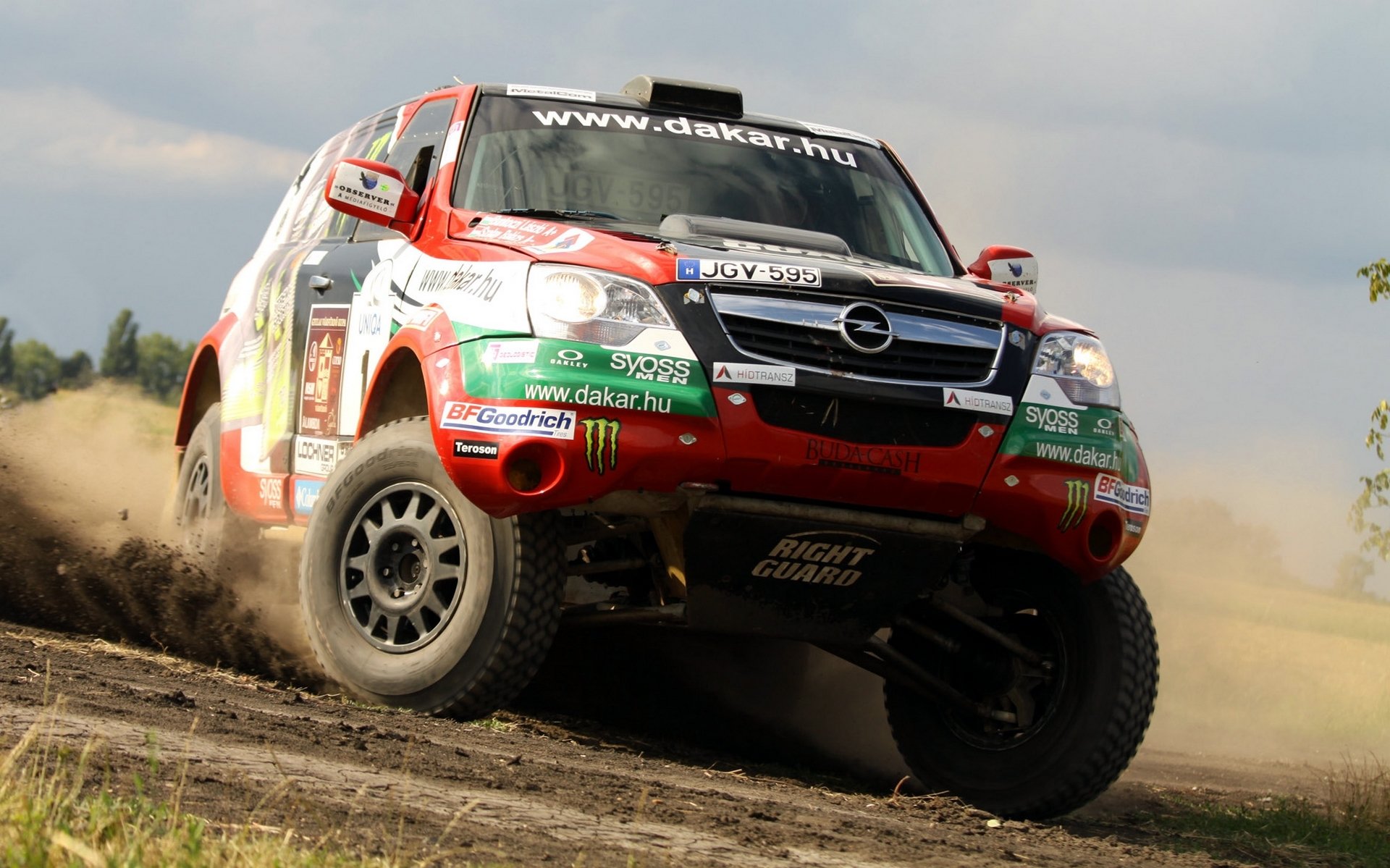 opel dakar rally auto suv anteriore logo sport auto fari skid turn giorno rally ruote in movimento jeep