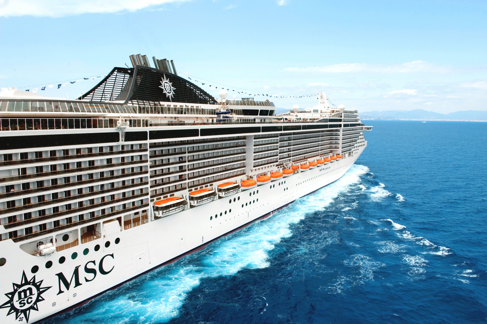 msc splendida ships liner passenger white body board sea boats deck on the fly day