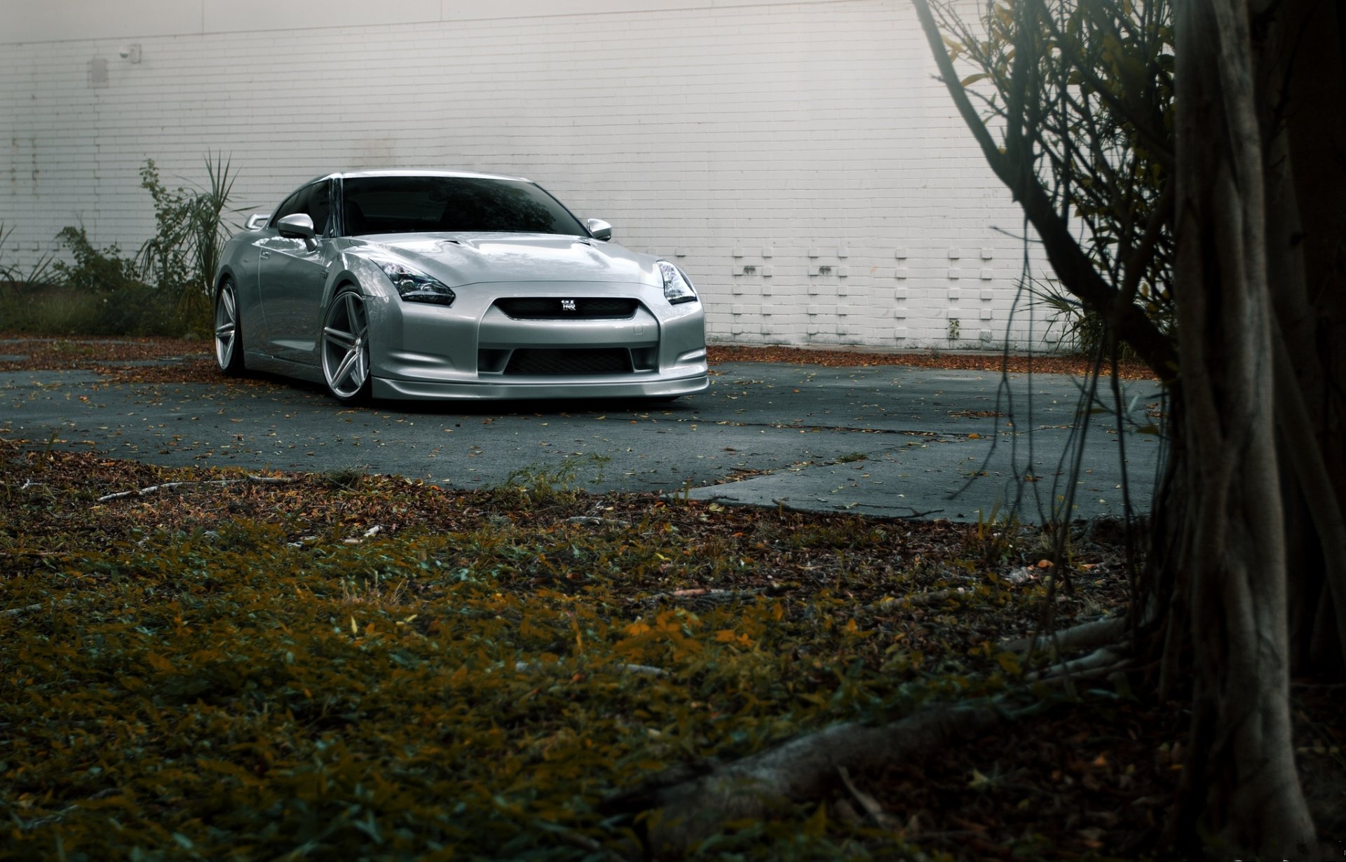 nissan gtr r35 plata carretera pared nissan gtr plata vista frontal césped