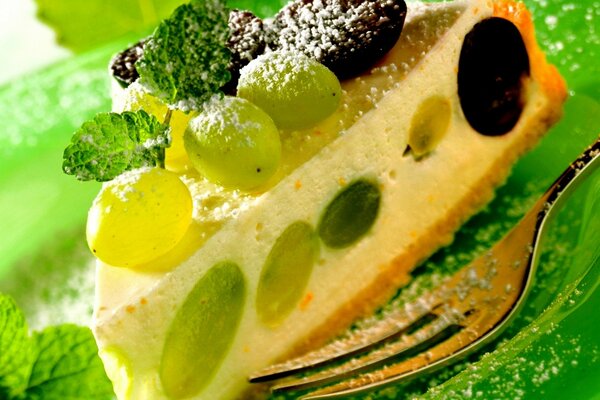 Cheesecake with grapes close-up