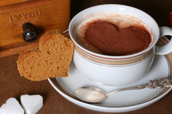 Coffee with a heart on a white saucer