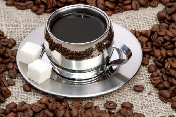 Coffee in a mug and sugar on a saucer