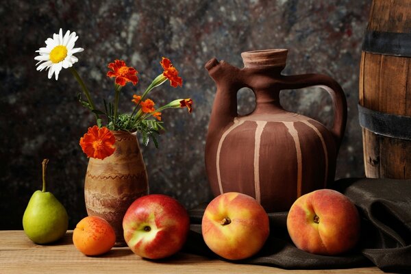 Ripe fruit on the table and a jug