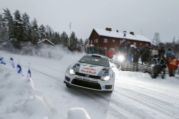 Racing on a snowy track on a volkswagen polo
