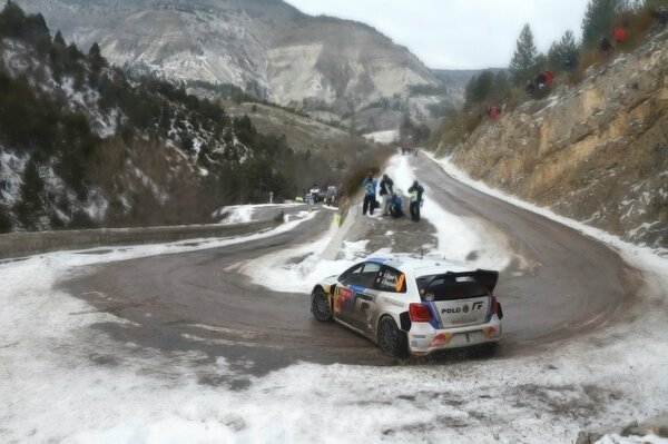 Mountains on the road snow, sharp turn, volzwagen polo