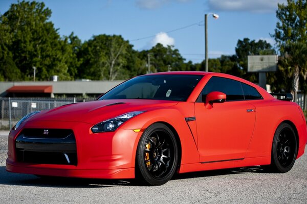 Matte red Nissan gtr with wheels