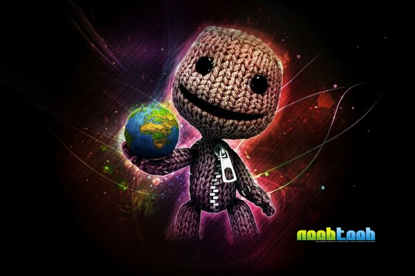 Knitted man holds the planet