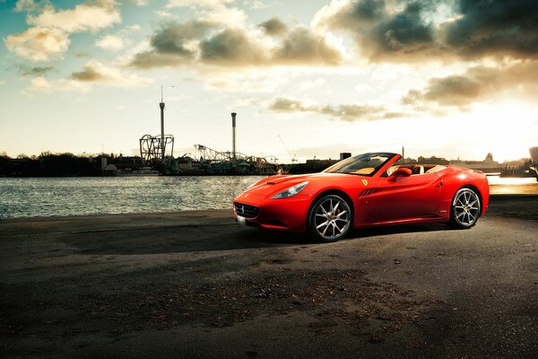 Ferrari California car on the pier by the river