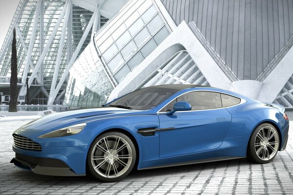 Синий Aston Martin Vanquish на фоне хай-тек архитектуры