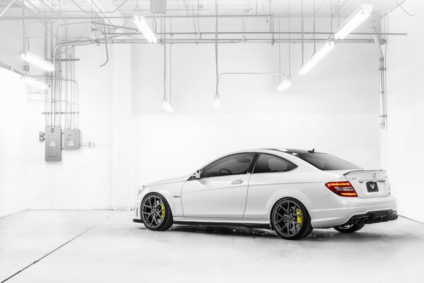 White mercedes-benz c-klasse with 63 amg