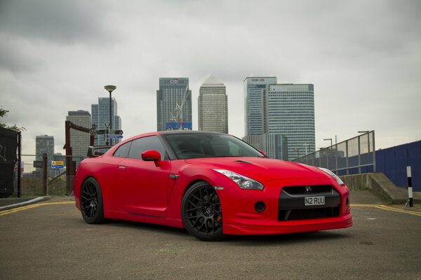 Beautiful car on the background of high-rise buildings