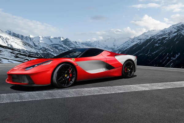 Ein rotes Auto steht auf der Straße hinter ihr malerischer arktischer Blick auf die schneebedeckten Berge