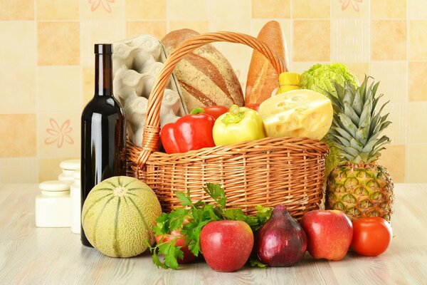 Fruit basket with pastries and wine