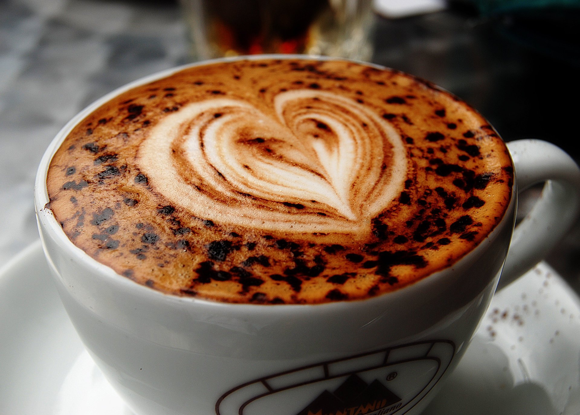 macro coffee cup figure heart cappuccino