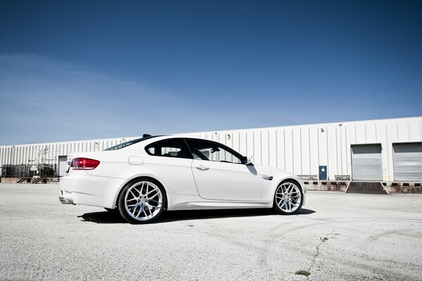 Three-door white BMW in the parking lot