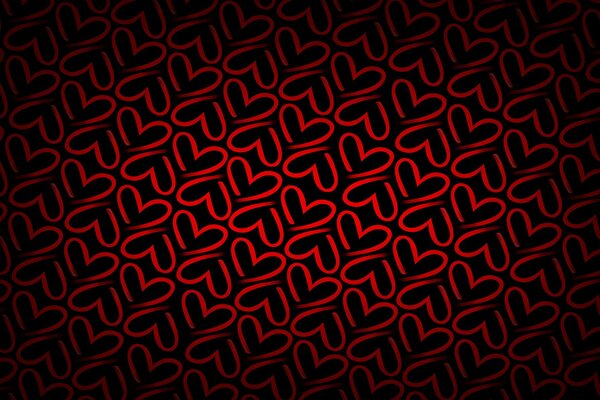 Texture with red hearts on a dark background
