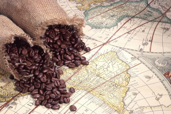 Coffee beans in a bag on an atlas