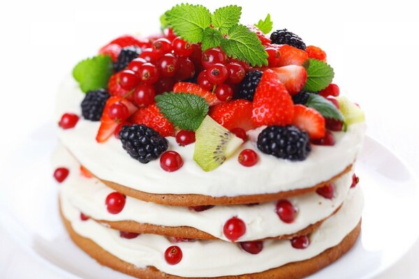 Pancakes with berries: strawberries, currants, kiwi, blackberries