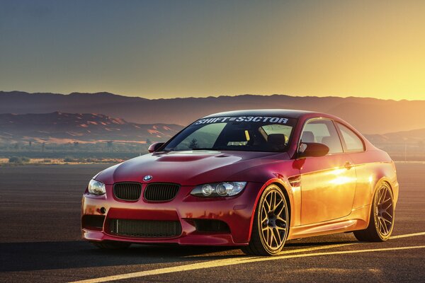 BMW sports car on the background of hills